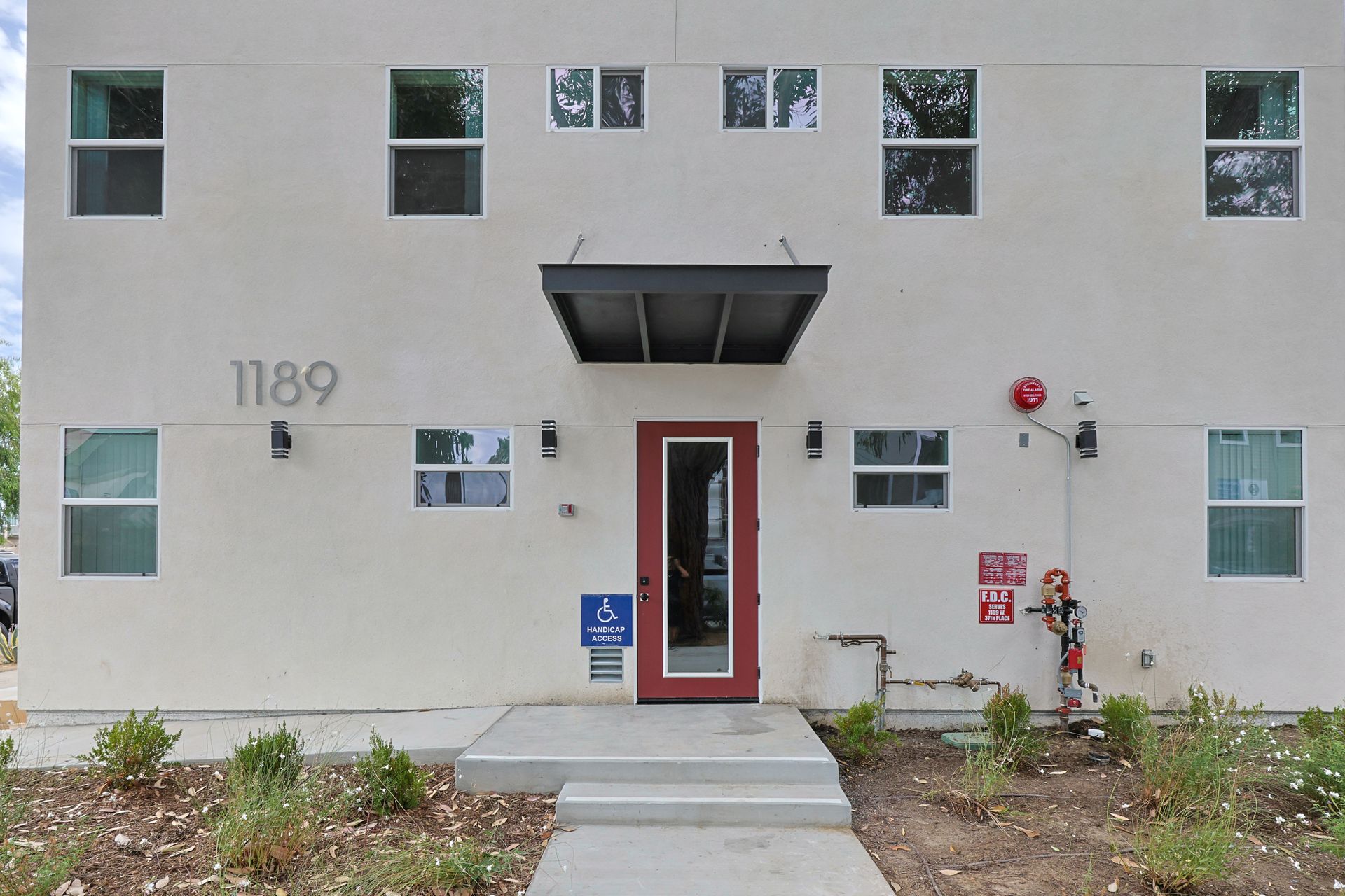 This image shows a beautiful buidling with windows and white background.