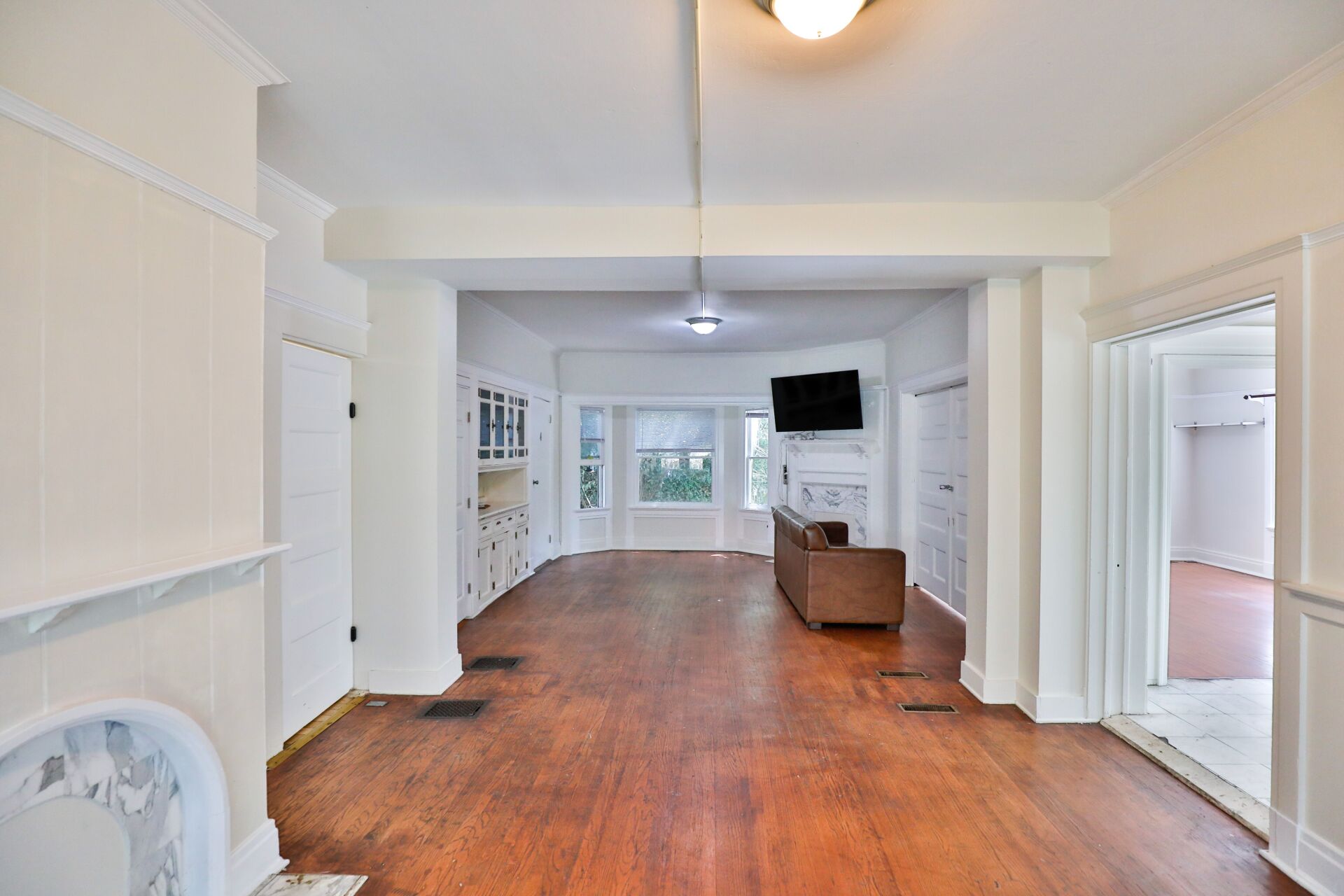 This shows the image of living room having one light and sofa