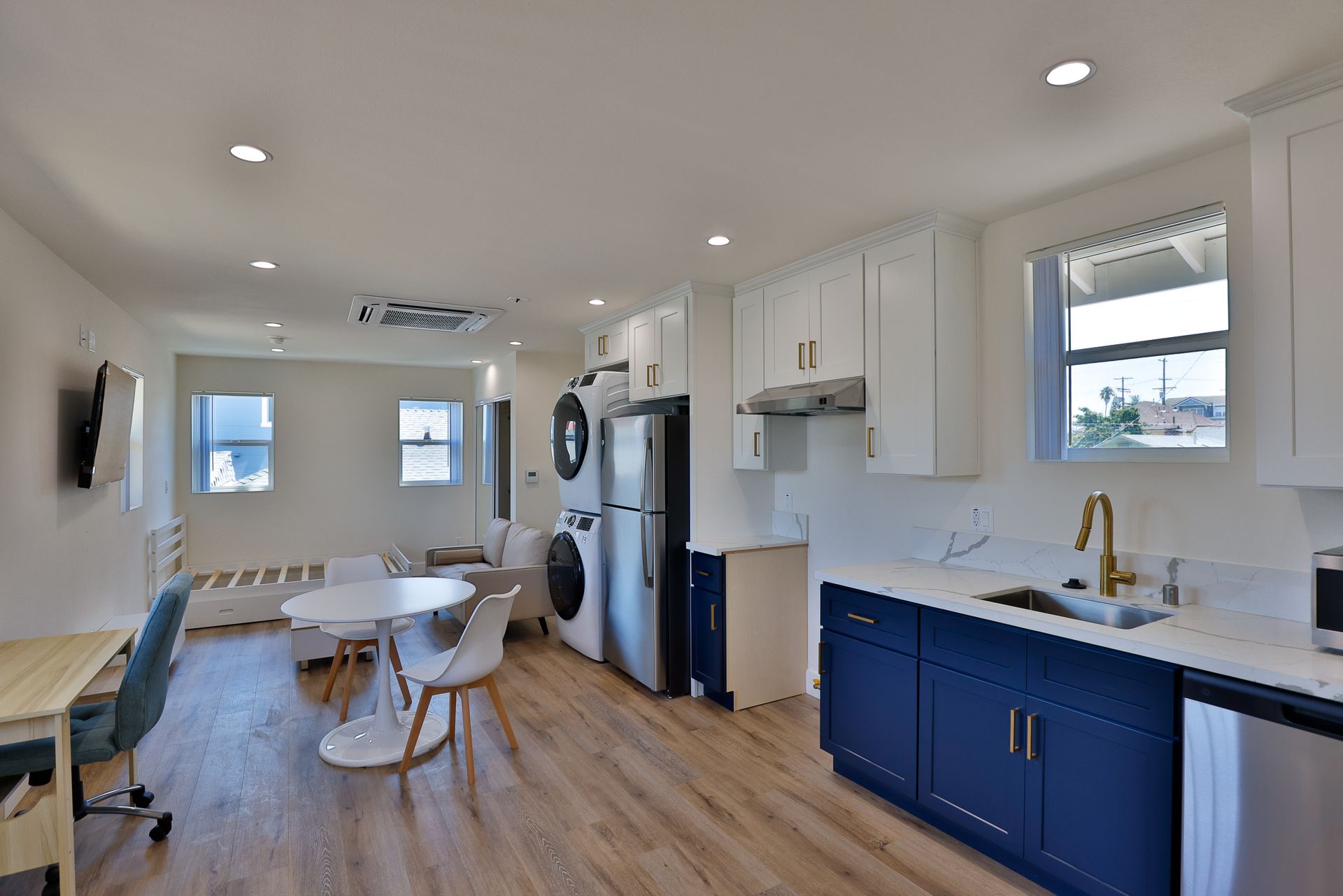 this image shows a beautiful kitchen of a home with brown background