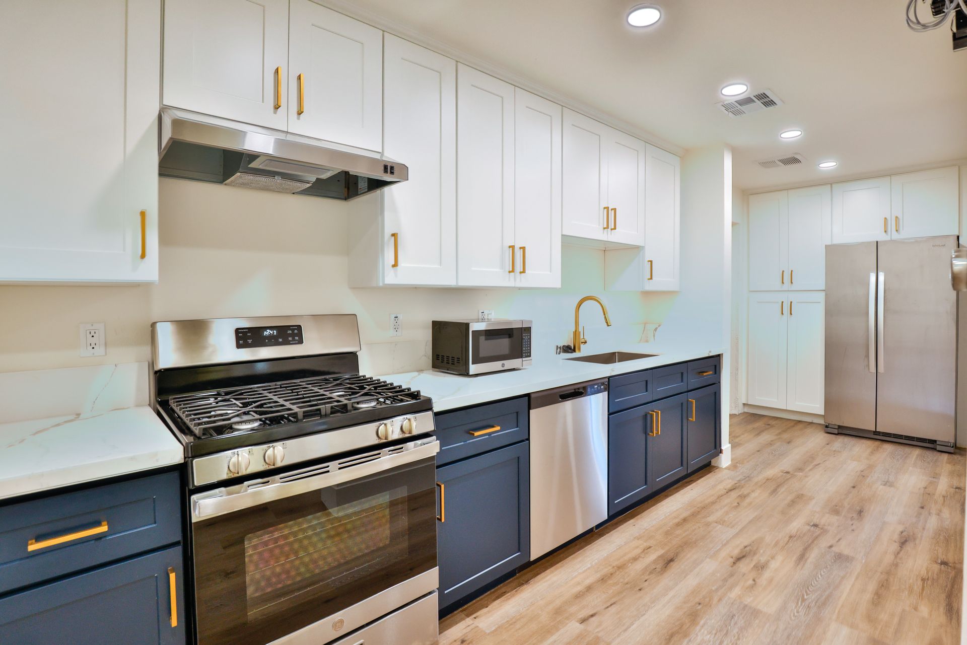 This image shows a beautiful kitchen having sink, oven and more