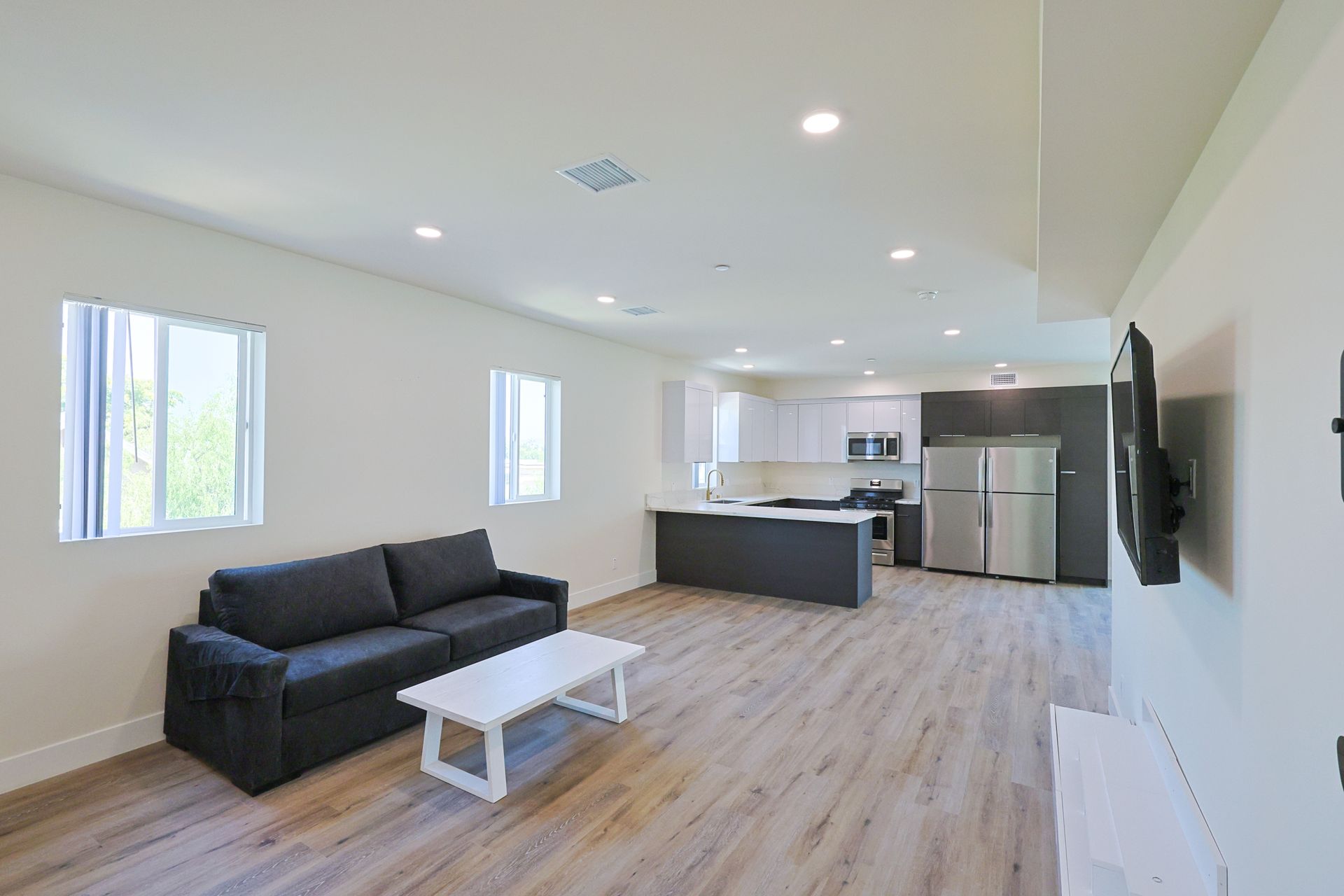 This image shows a sitting area and LED with white and brown background.