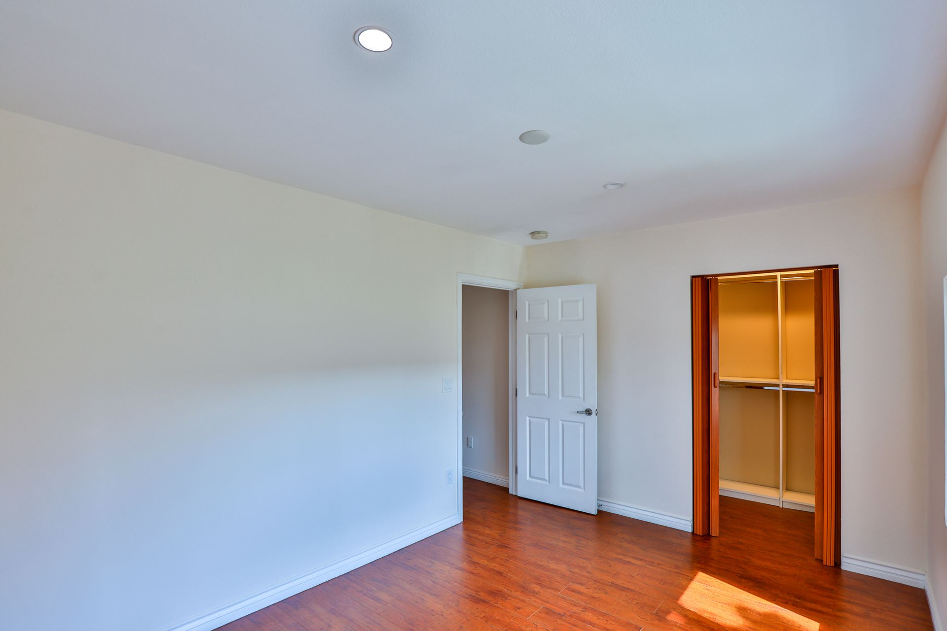 This image showing a room with one cupbard and exit door in it