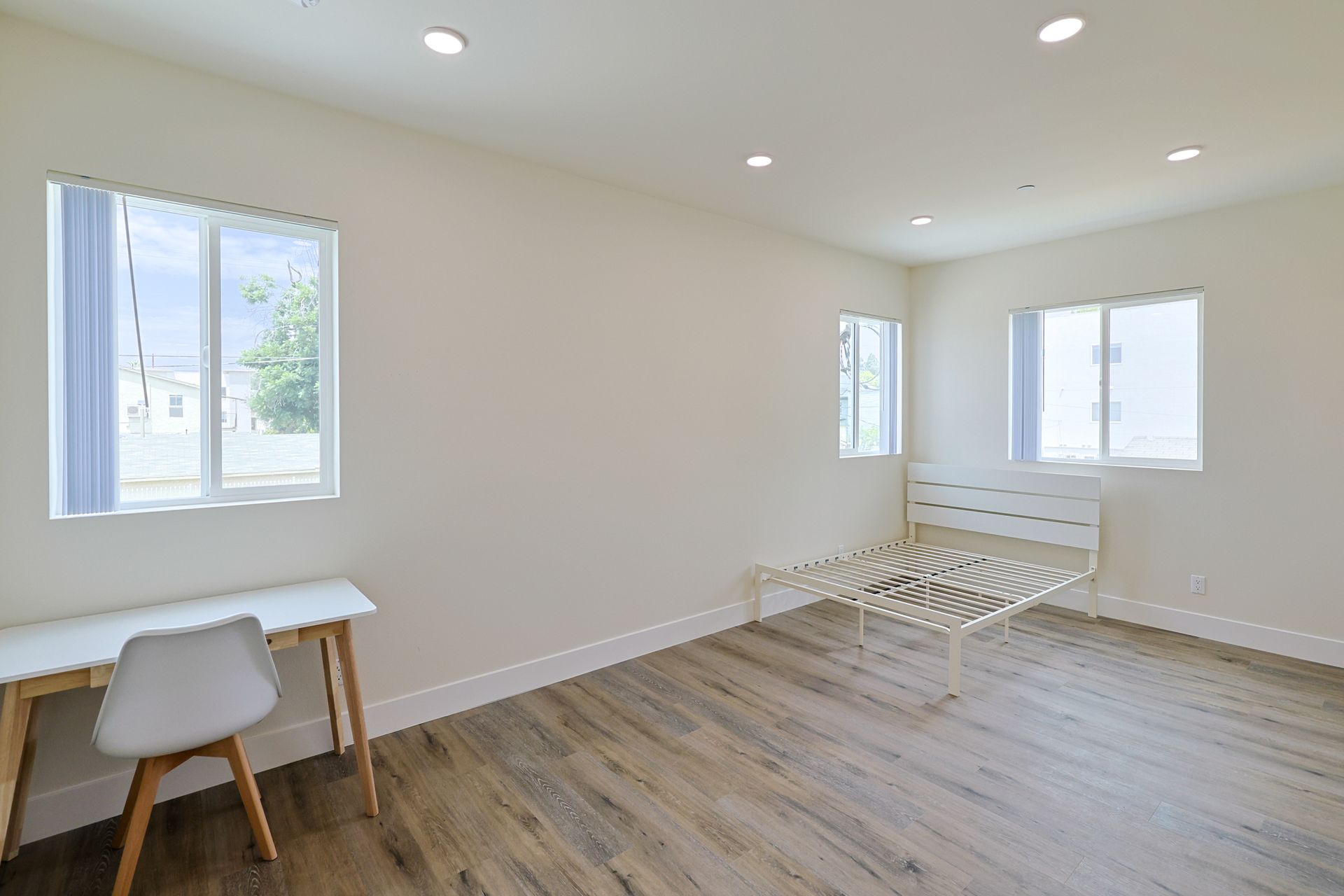 This image shows a small sitting place with one chair and tabe .