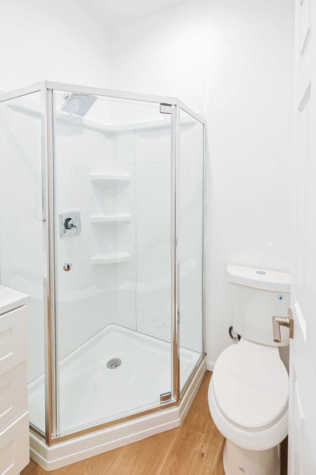 This image showing a bathroom in white with all features.