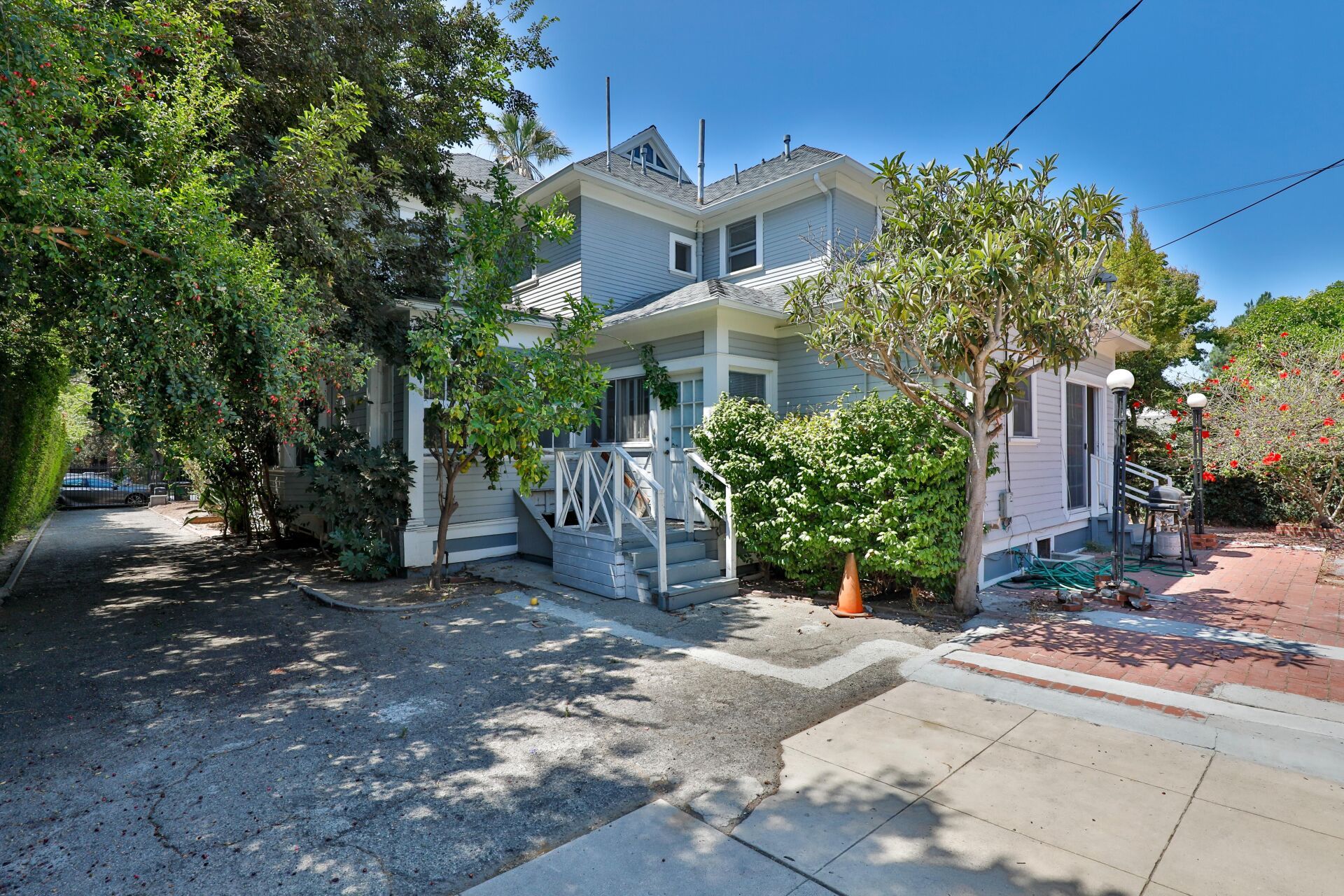 This image shows a beautiful house with greenery