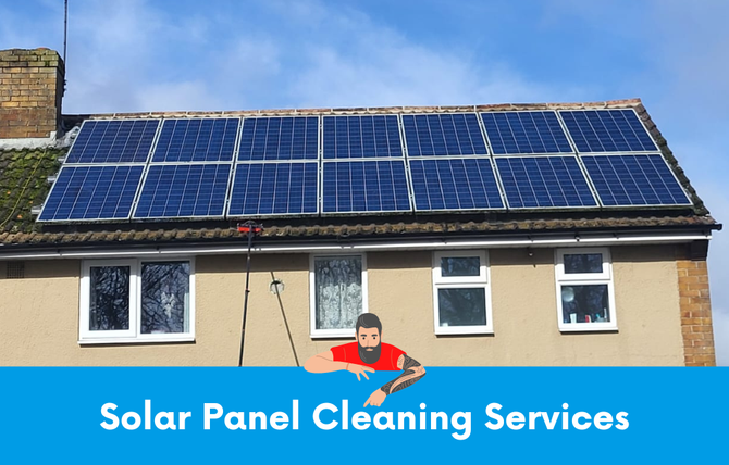 A man is cleaning the solar panels on the roof of a house.