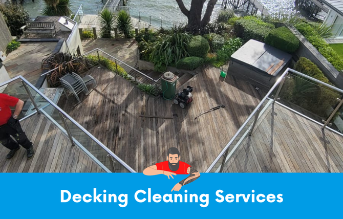 A man is cleaning a wooden deck with a cleaner.