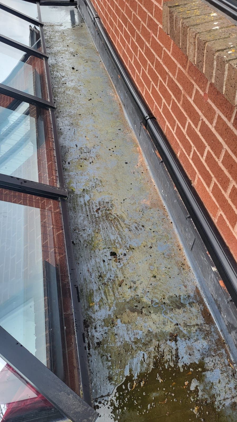 grey guttering with dirt patches