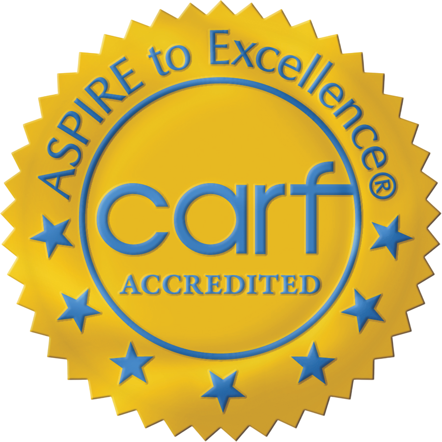 CARF Accreditation seal, gold and blue: 