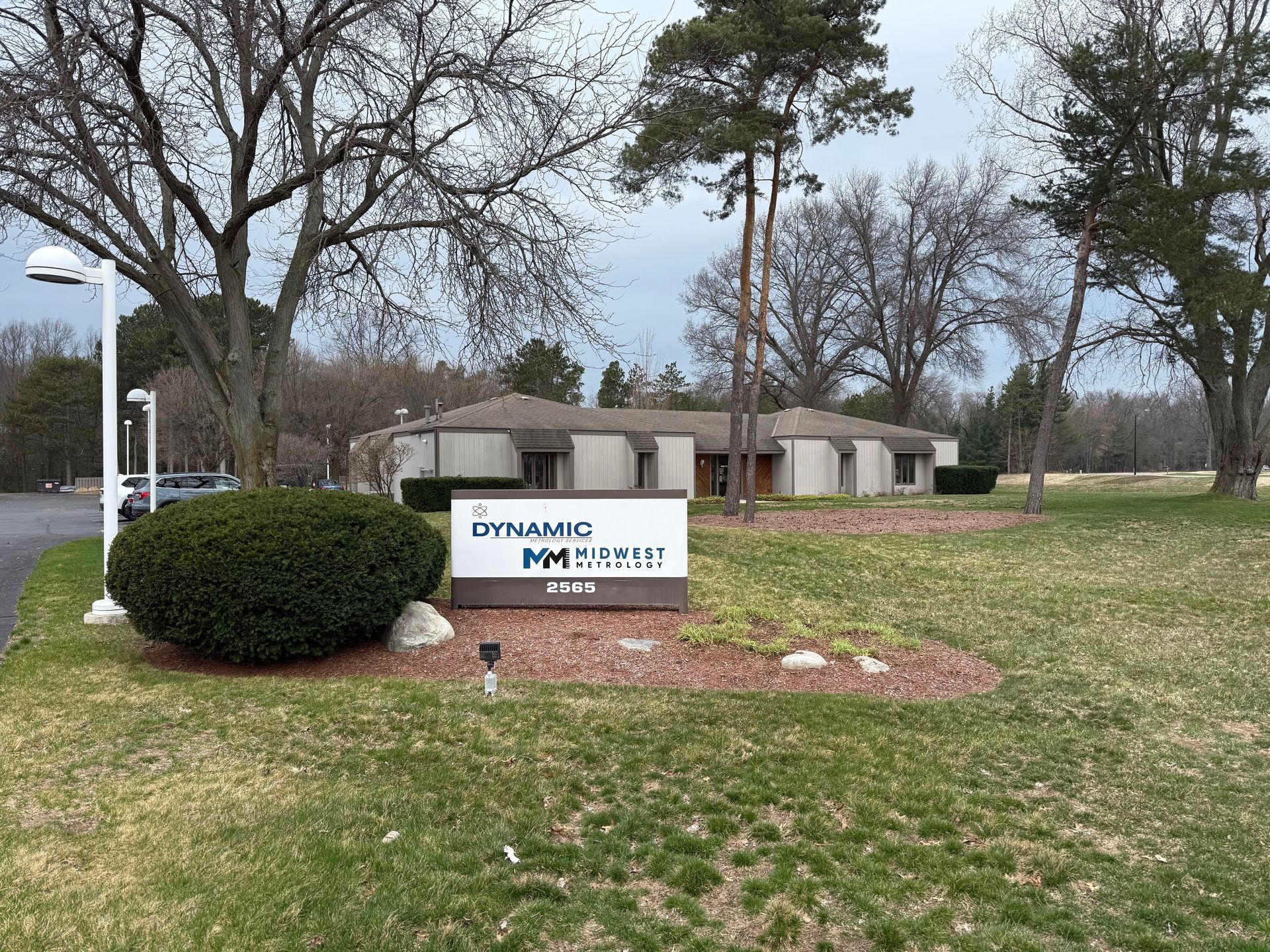 A plastic injection molding machine is making a blue cup.