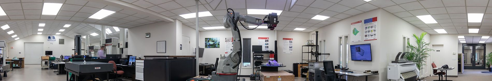 A blurred image of a large room with a lot of lights on the ceiling.