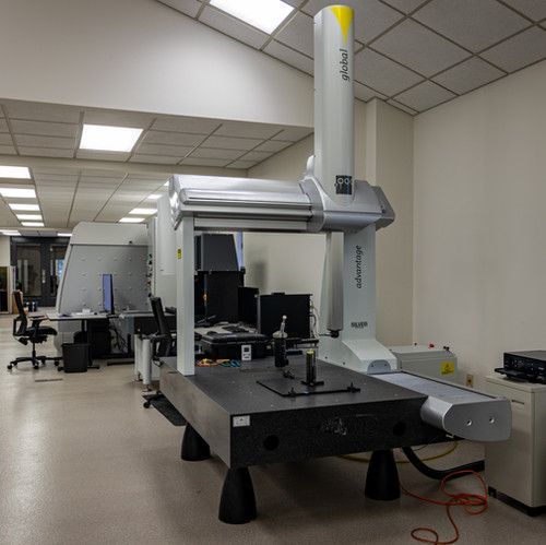 A large machine is sitting on a table in a room.