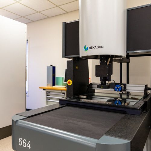 A machine with the number 664 on it is sitting in a room.