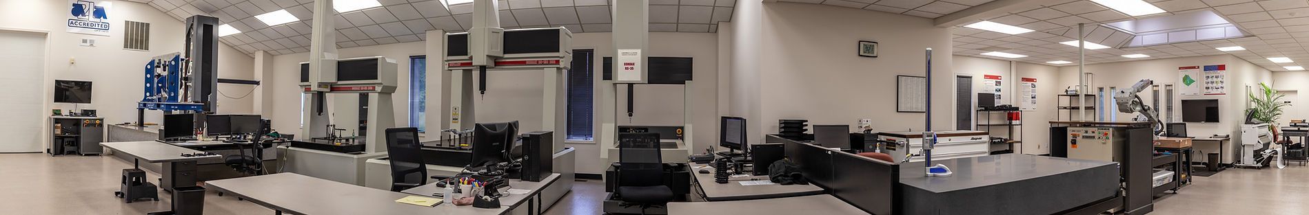 A panoramic view of a large room with a lot of tables and chairs.