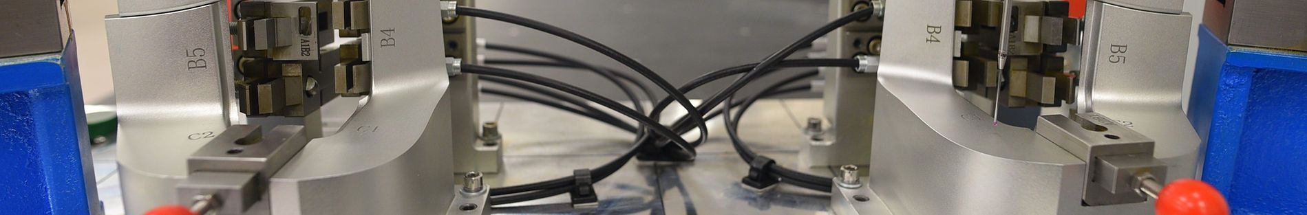 A close up of a machine with a lot of wires coming out of it.