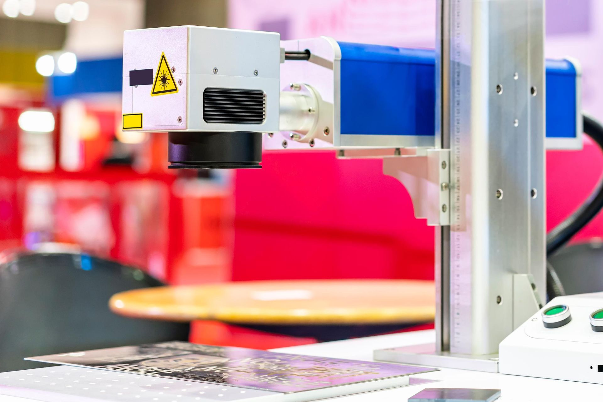 A laser cutting machine is sitting on top of a table.