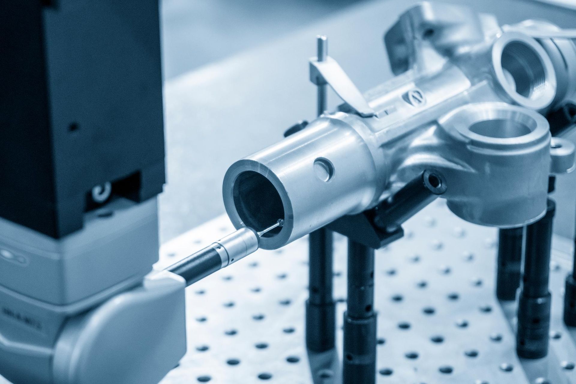 A laser cutting machine is sitting on top of a table.