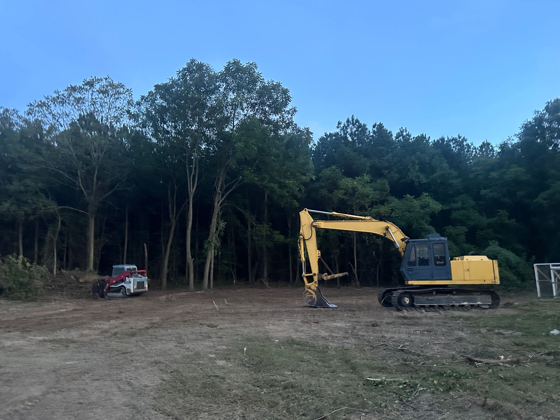 Land clearing equipment removing large trees in Milford Delaware
