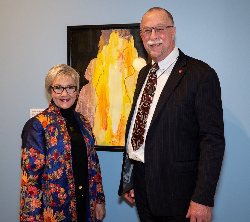 Helen and Stuart MacDiarmid with their painting 'Basic Energy 2008' by Douglas MacDiarmid at the Wellington launch of the Colours of a Life biography at the New Zealand Portrait Gallery. Image: James Gilberd, Photospace, Wellington, New Zealand