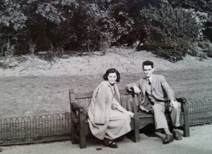 Douglas MacDiarmid and Danuta sitting in Battersea Park, London, 1947