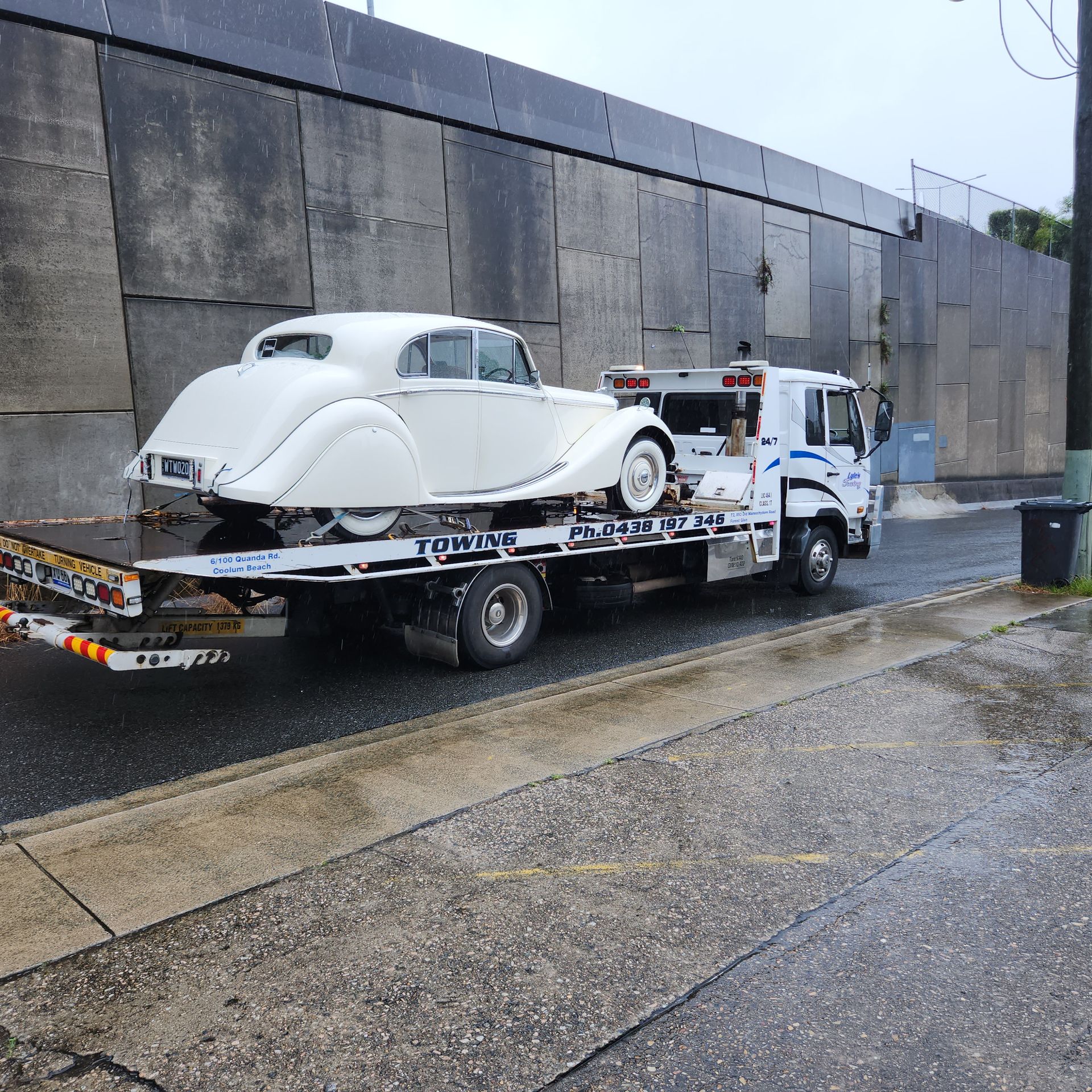 A Tow Truck towing a white Old School Car— Lyle's Towing In Little Mountain, QLD