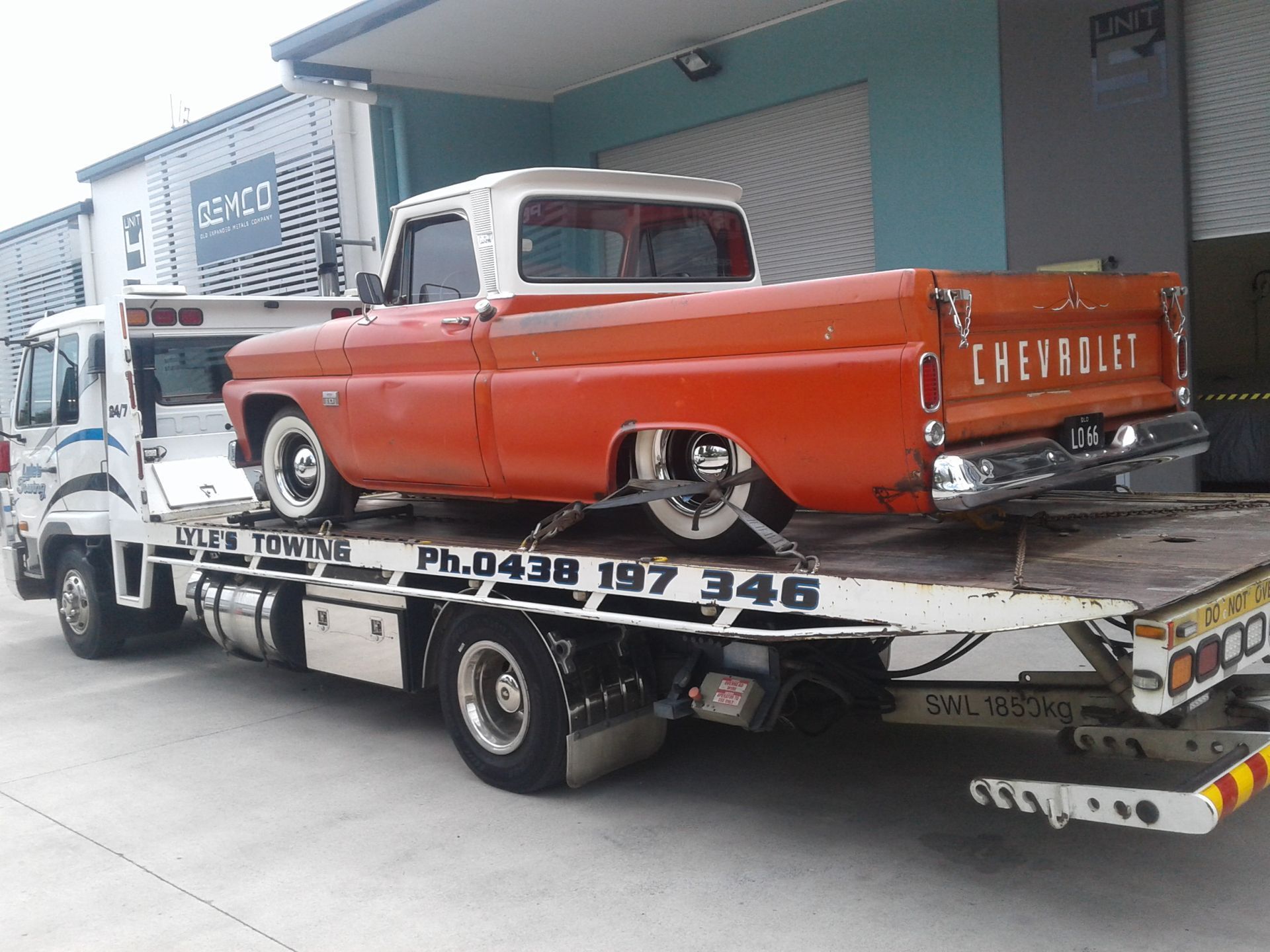 A Chevrolet Truck is Being Towed by a Tow Truck — Lyle's Towing In Caloundra, QLD