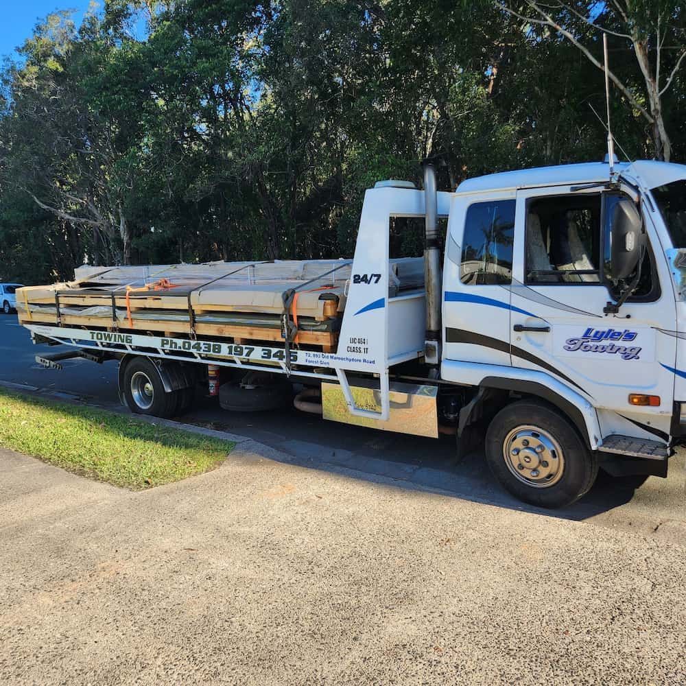A White Tow Truck is Parked on the Side of the Road — Lyle's Towing In Little Mountain, QLD
