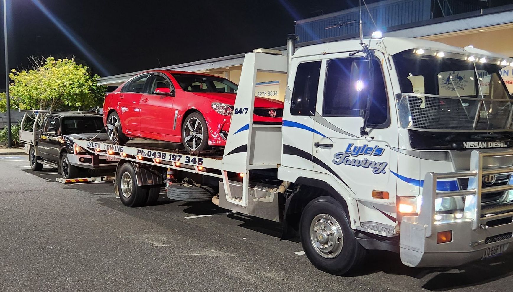 A Tow Truck towing a Mustang — Lyle's Towing In Little Mountain, QLD
