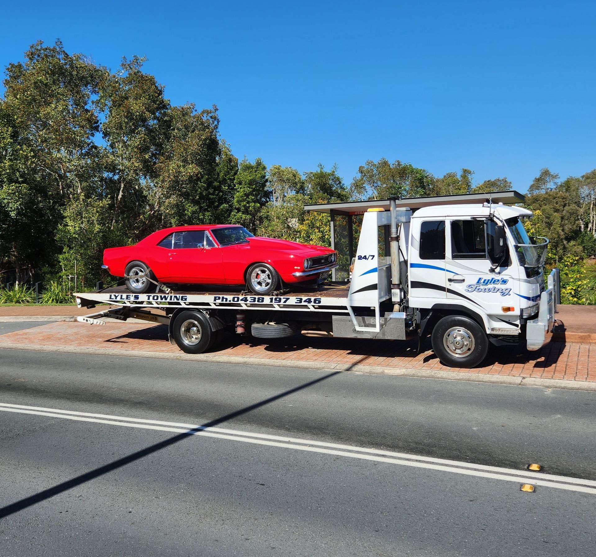 A Tow Truck towing a Mustang — Lyle's Towing In Little Mountain, QLD