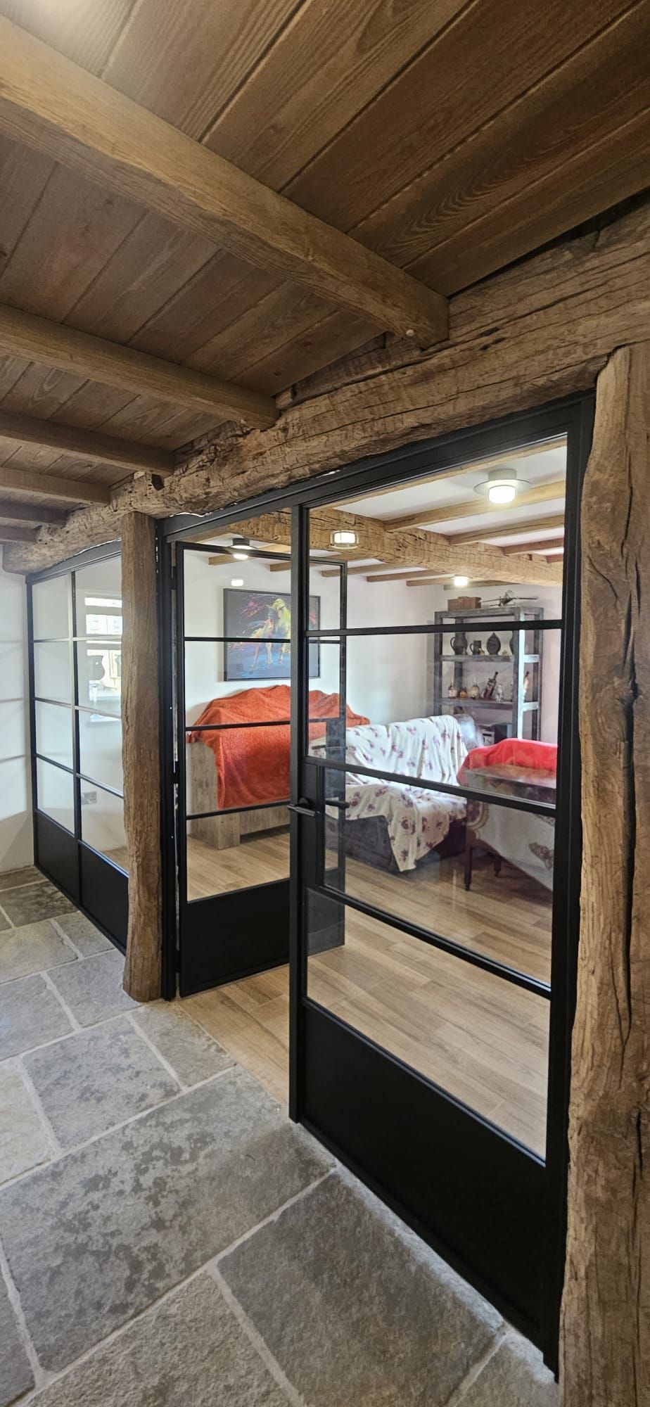 Steel and glass Crittall-style doors installed in a Cheshire farmhouse kitchen
