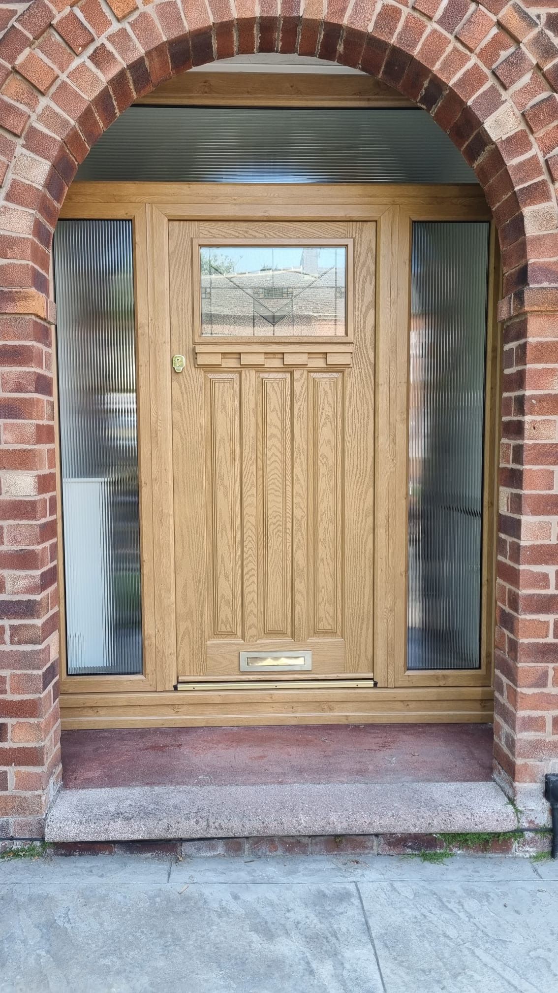 Irish Oak composite front door with matching frame, reeded glass side panels 