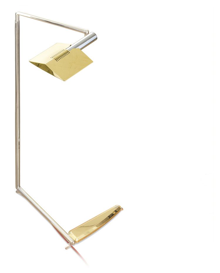 a lamp with a brass shade on a white background