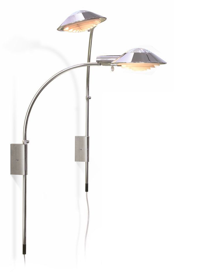 two lamps are mounted to a wall with a white background