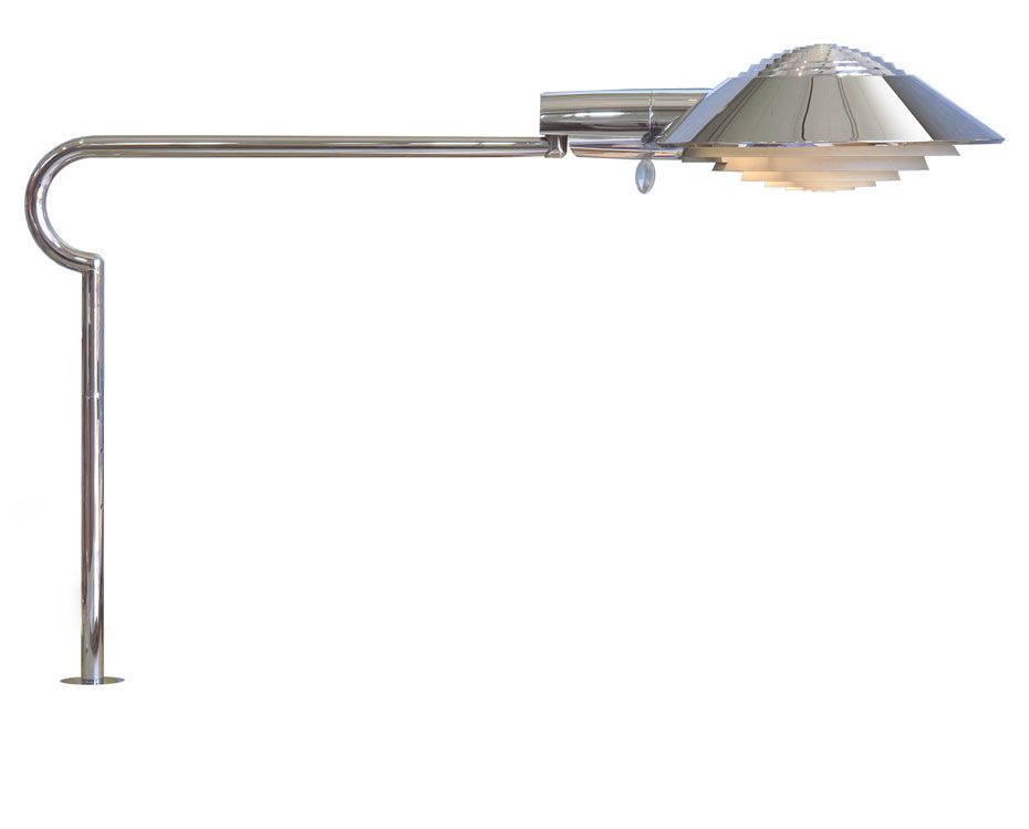 a chrome lamp with a cone shaped shade on a white background .