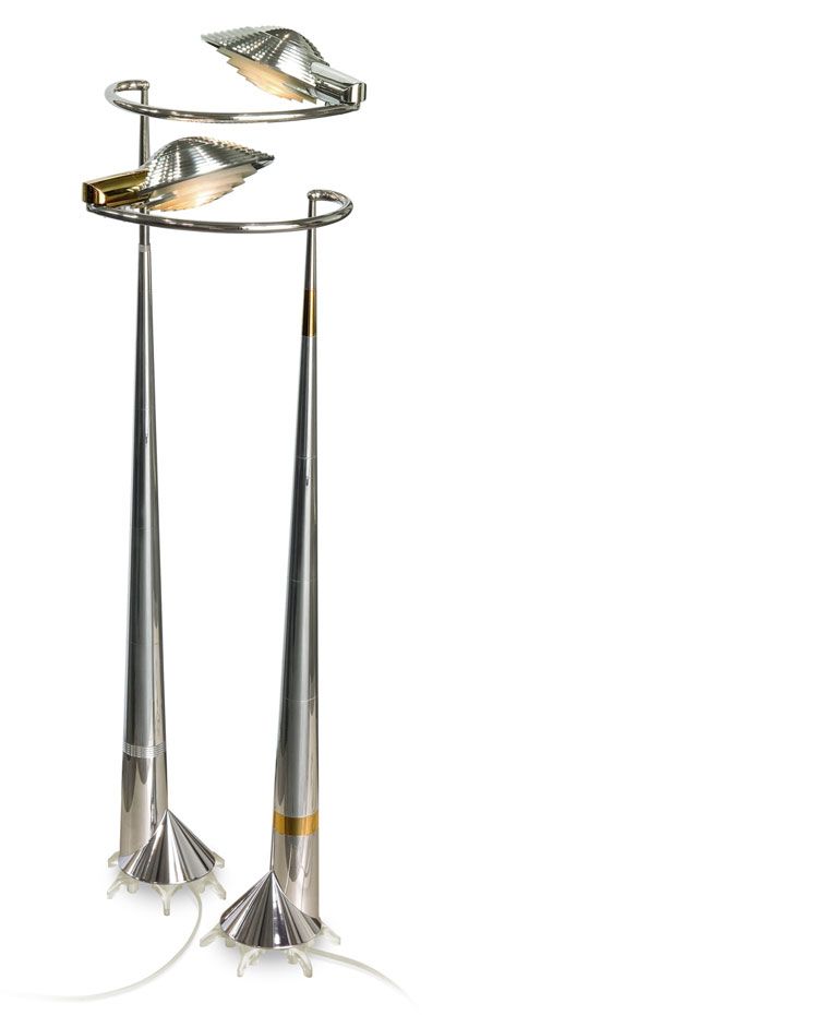 two silver lamps are sitting next to each other on a white background .