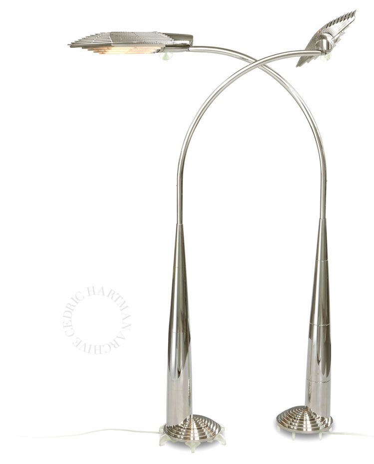 a pair of chrome floor lamps with a white background