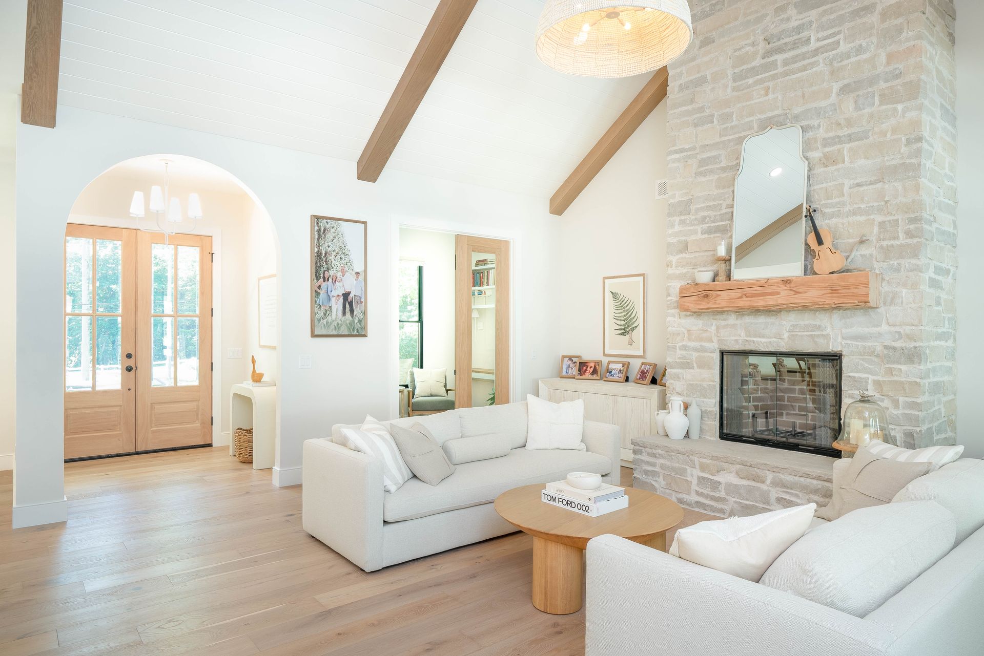 A living room filled with furniture and a fireplace.