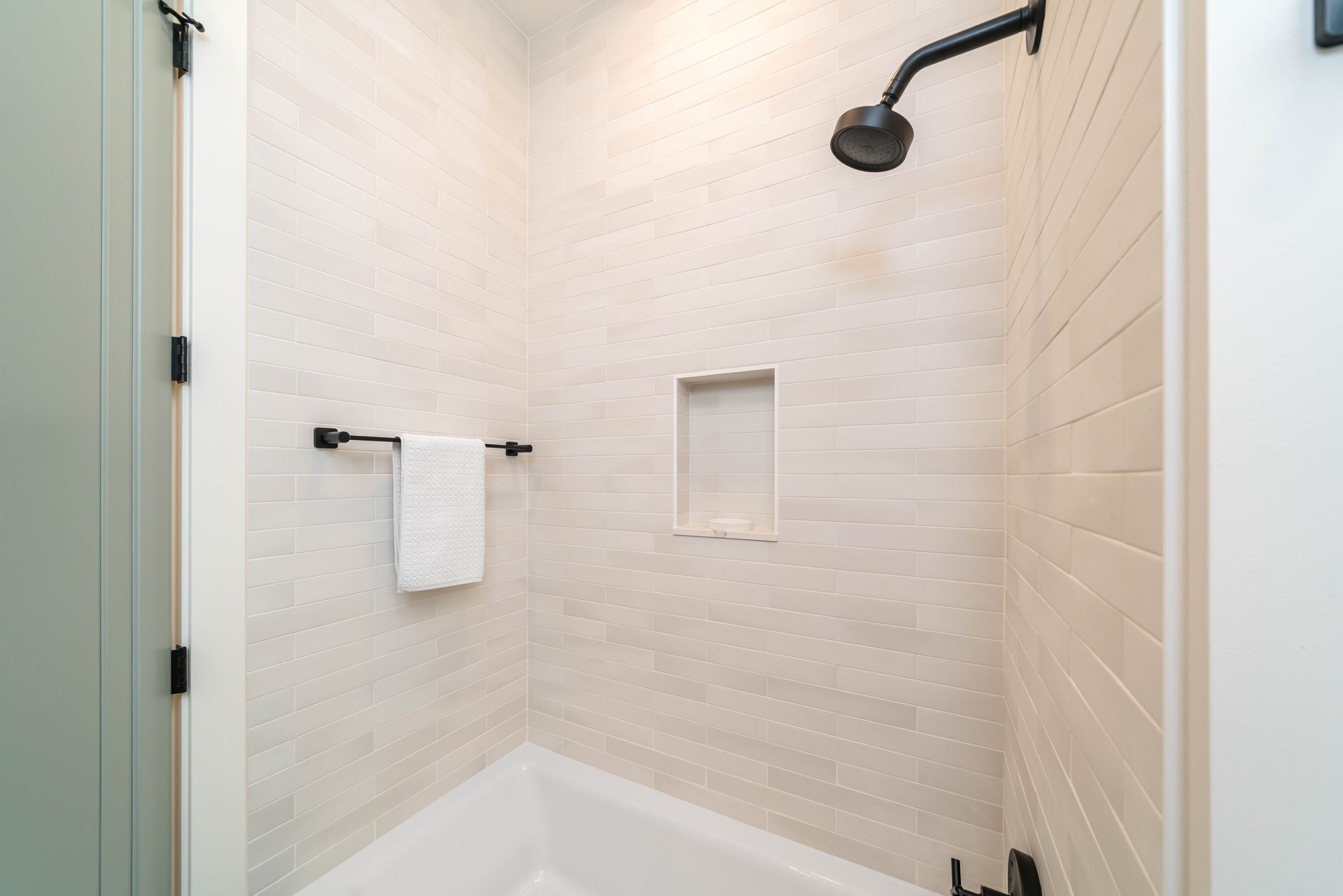 A bathroom with a shower and a bathtub.