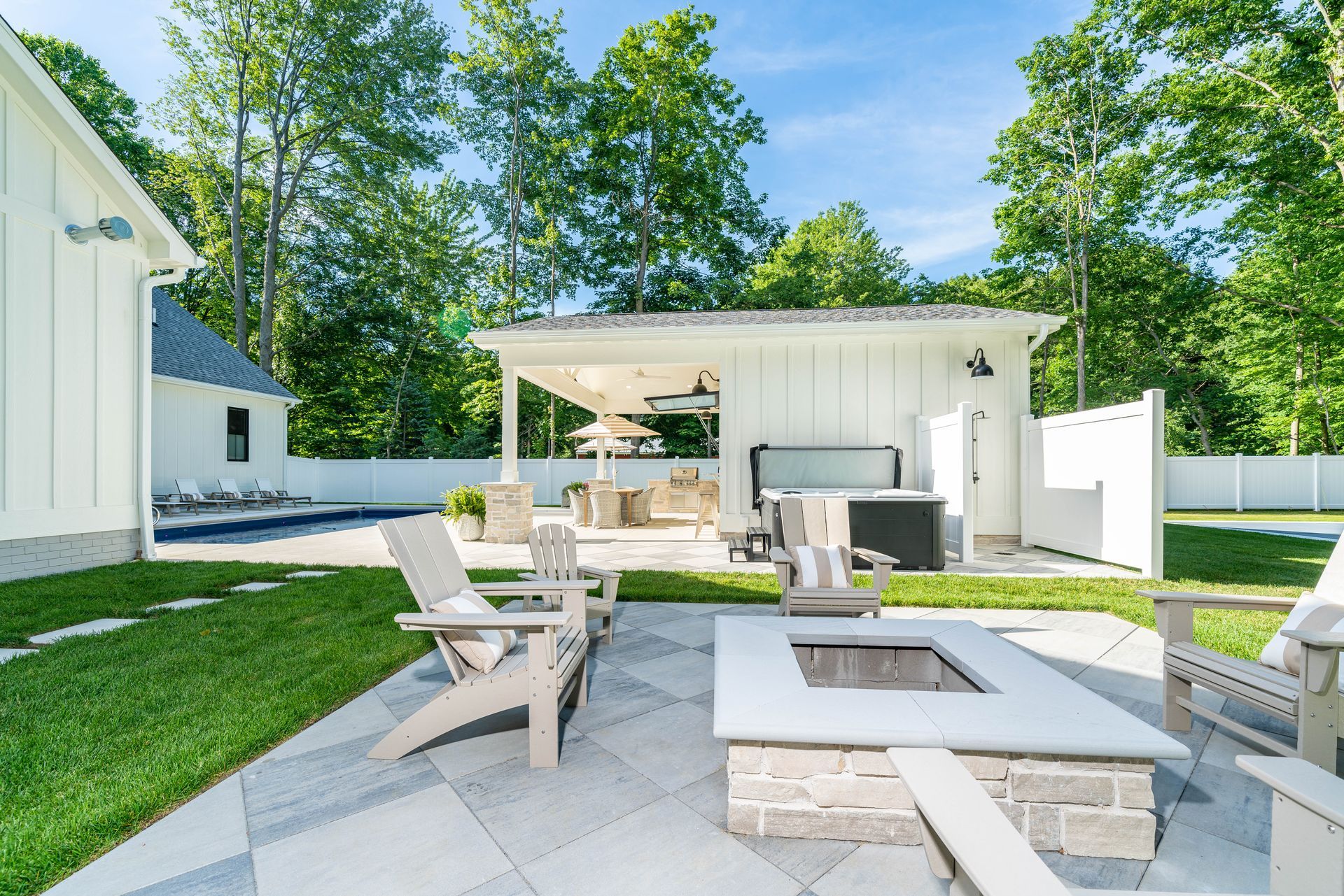 There is a fire pit in the middle of the backyard