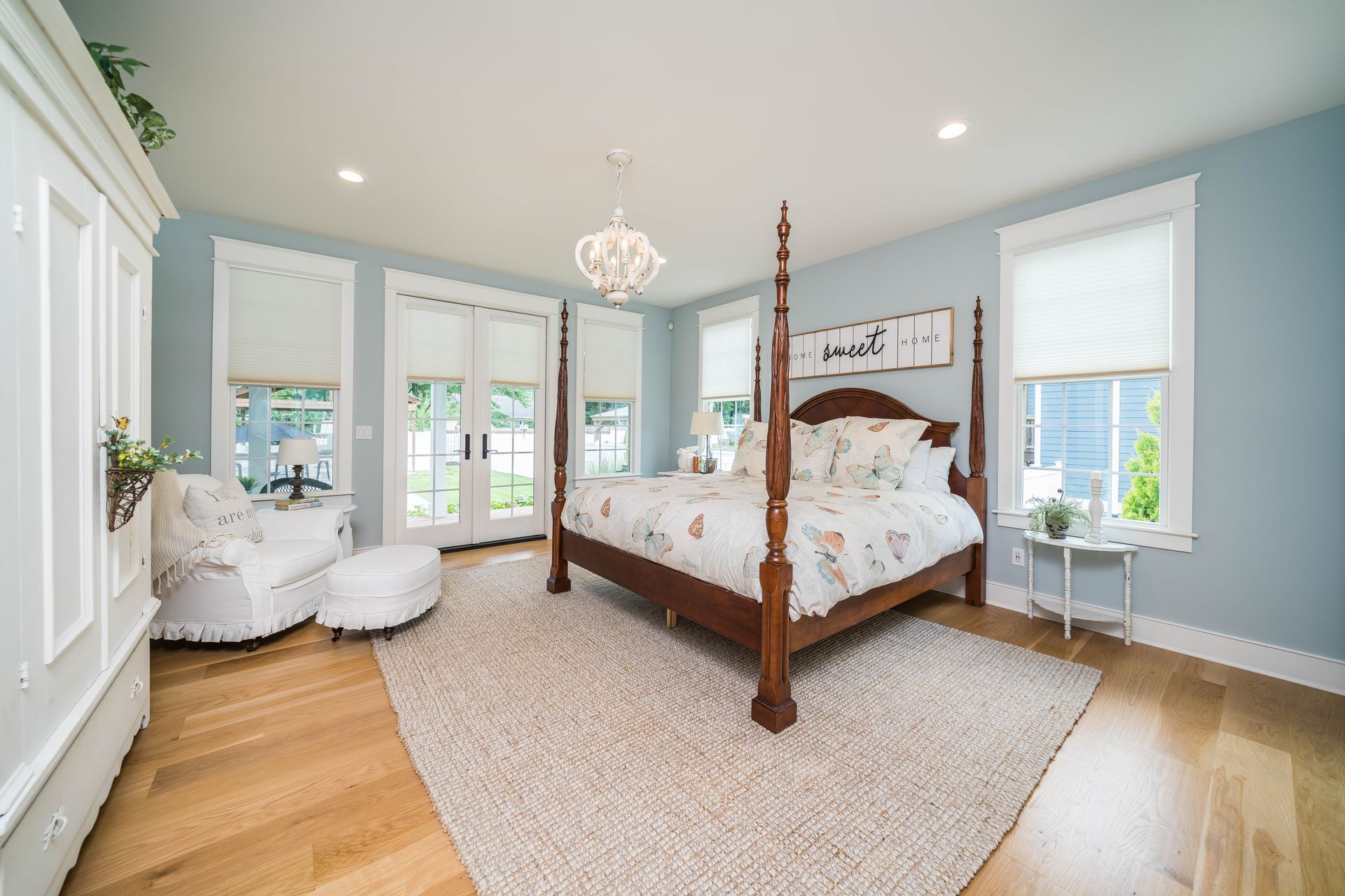 There is a four poster bed in the middle of the room.