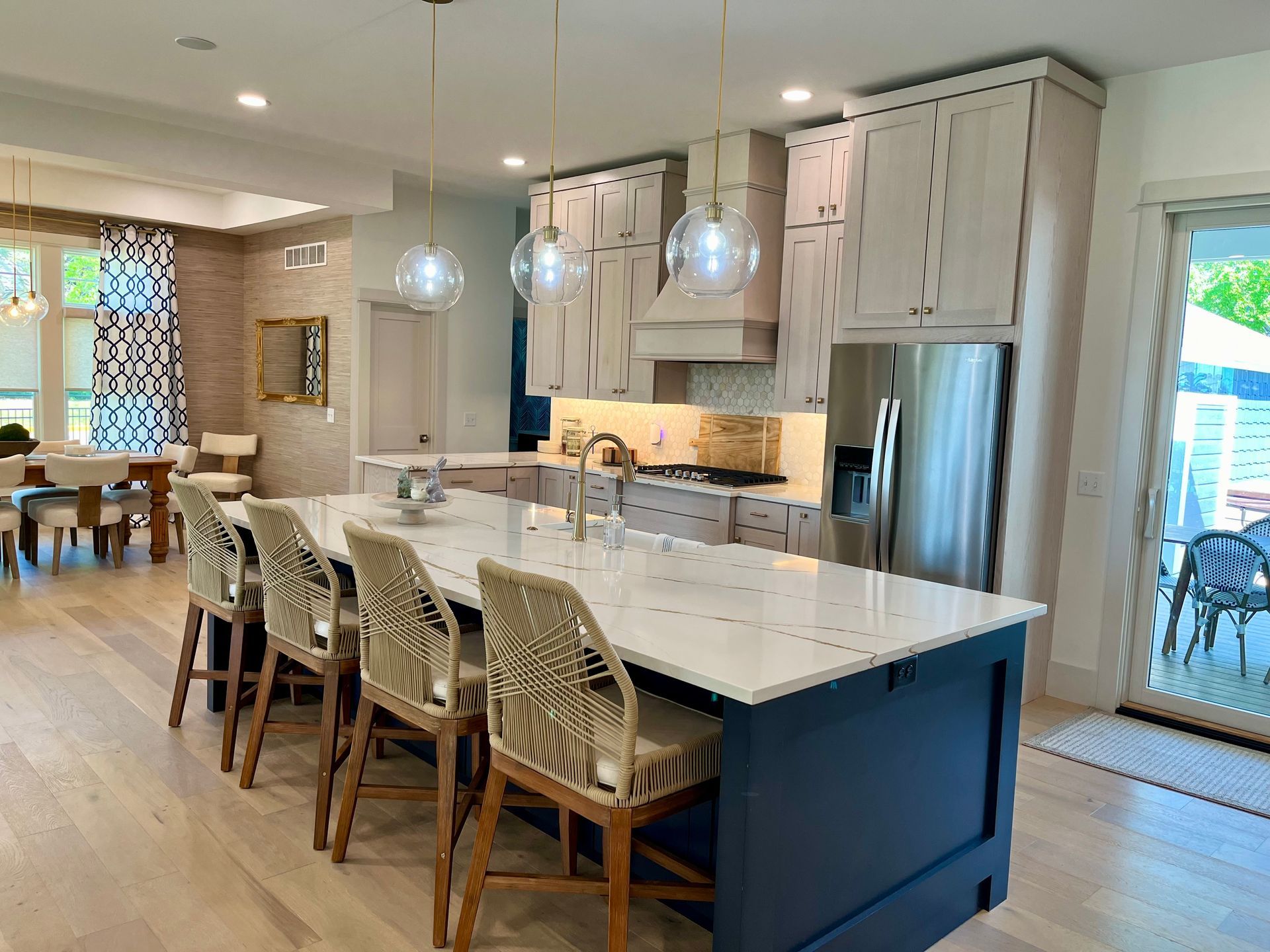 There is a large island in the middle of the kitchen.