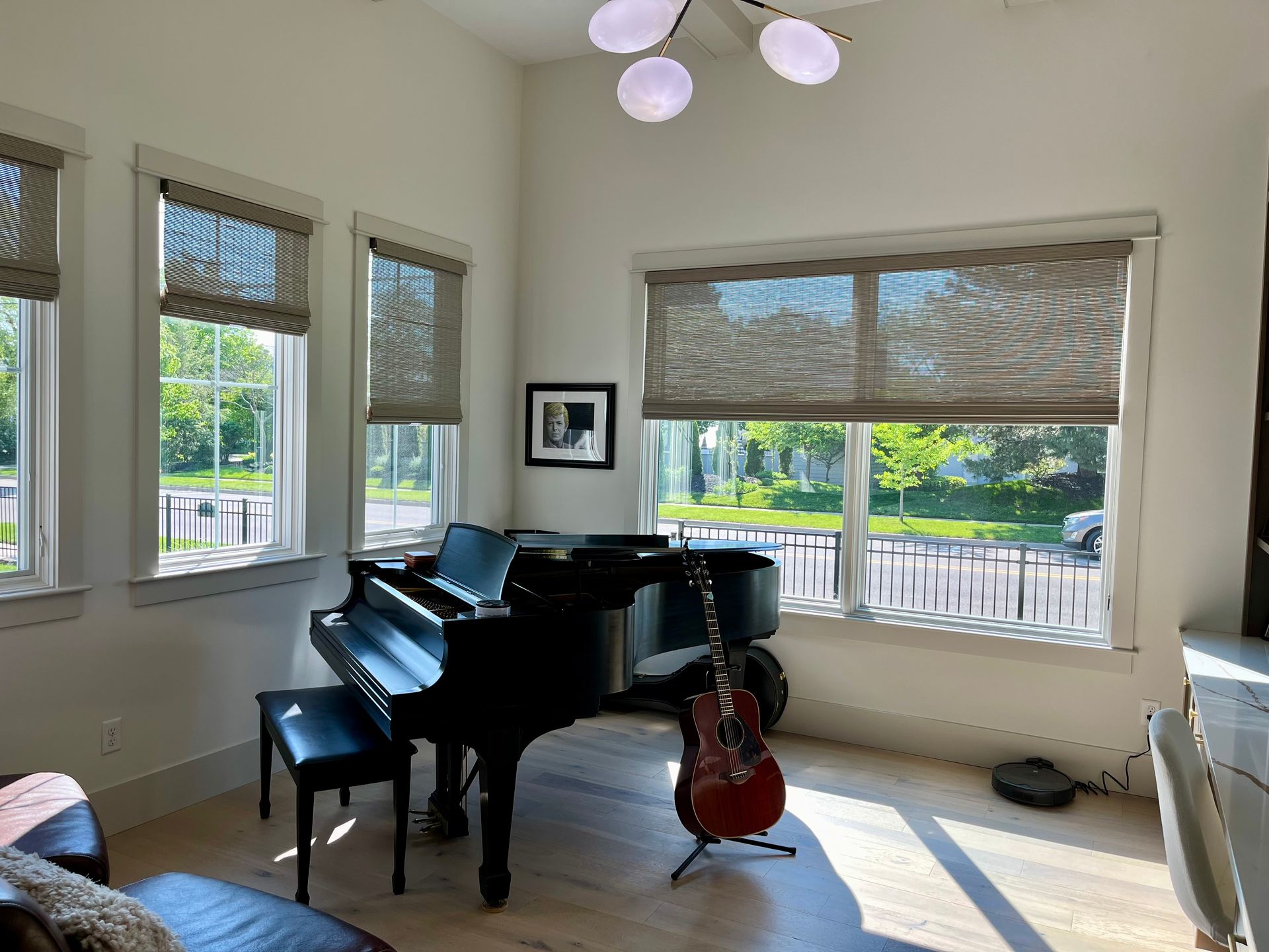 A living room with a piano and a guitar