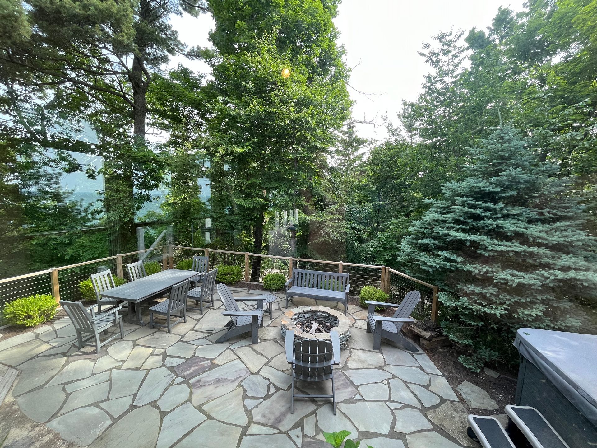 There is a fire pit in the middle of the patio.