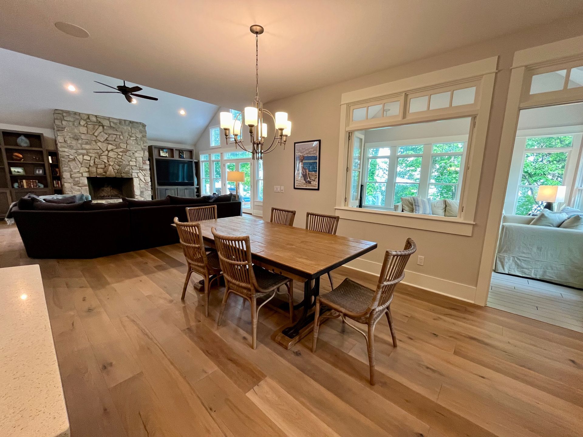 There is a dining table and chairs in the middle of the room.
