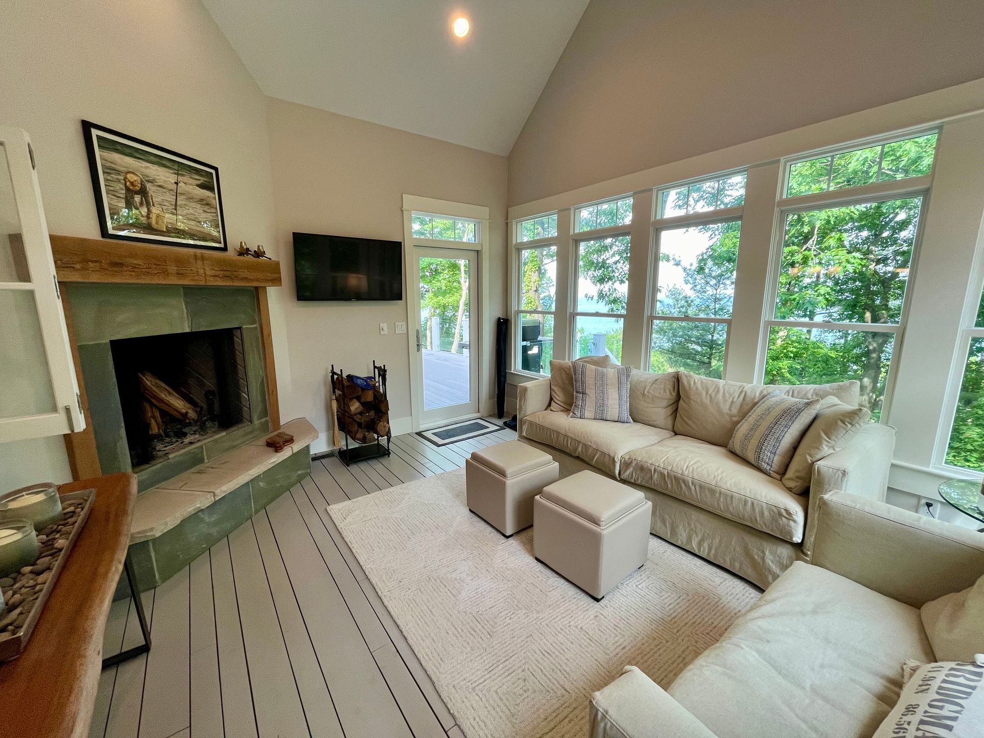 A living room filled with furniture and a fireplace.