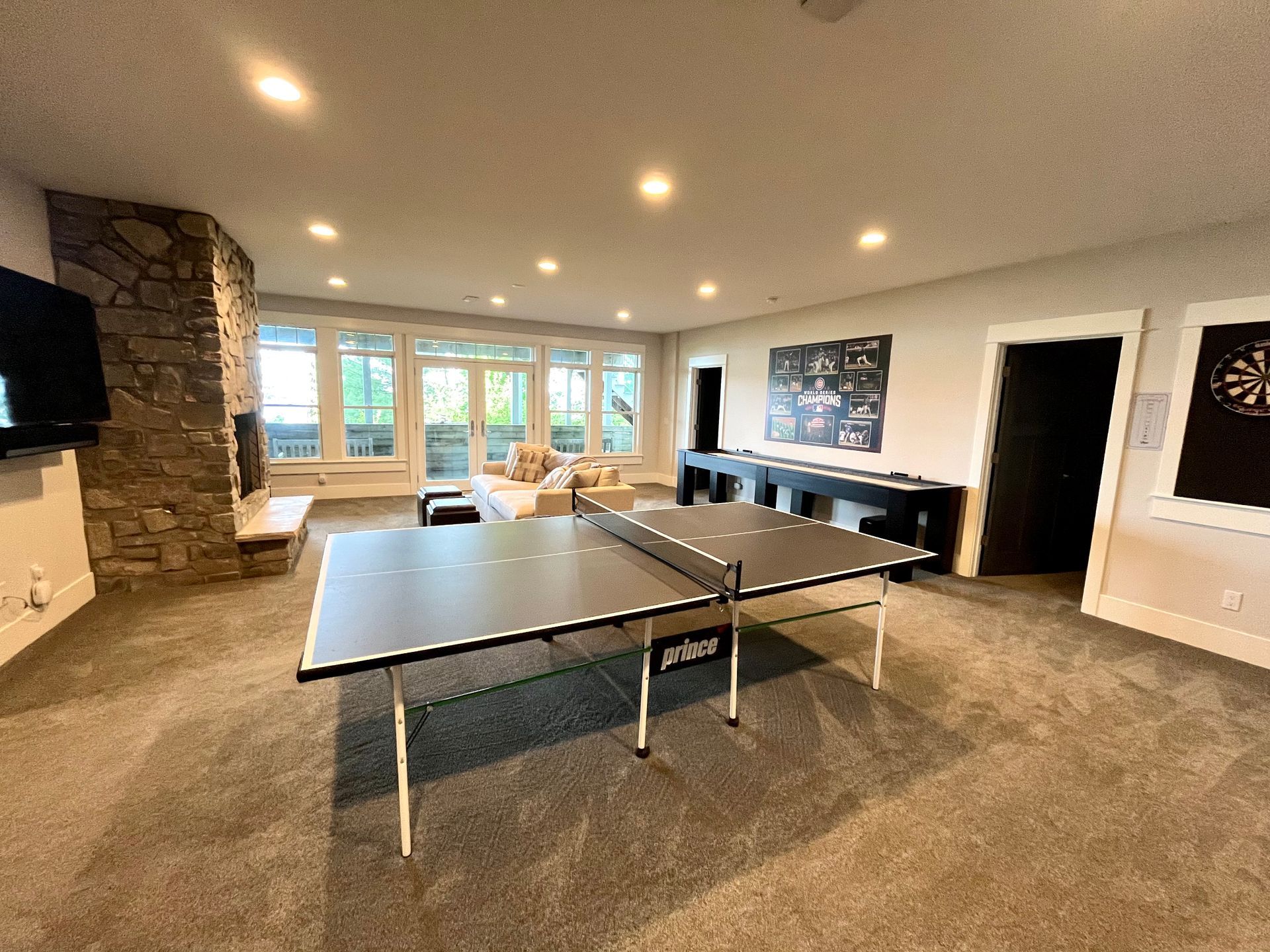 There is a ping pong table in the middle of the room.