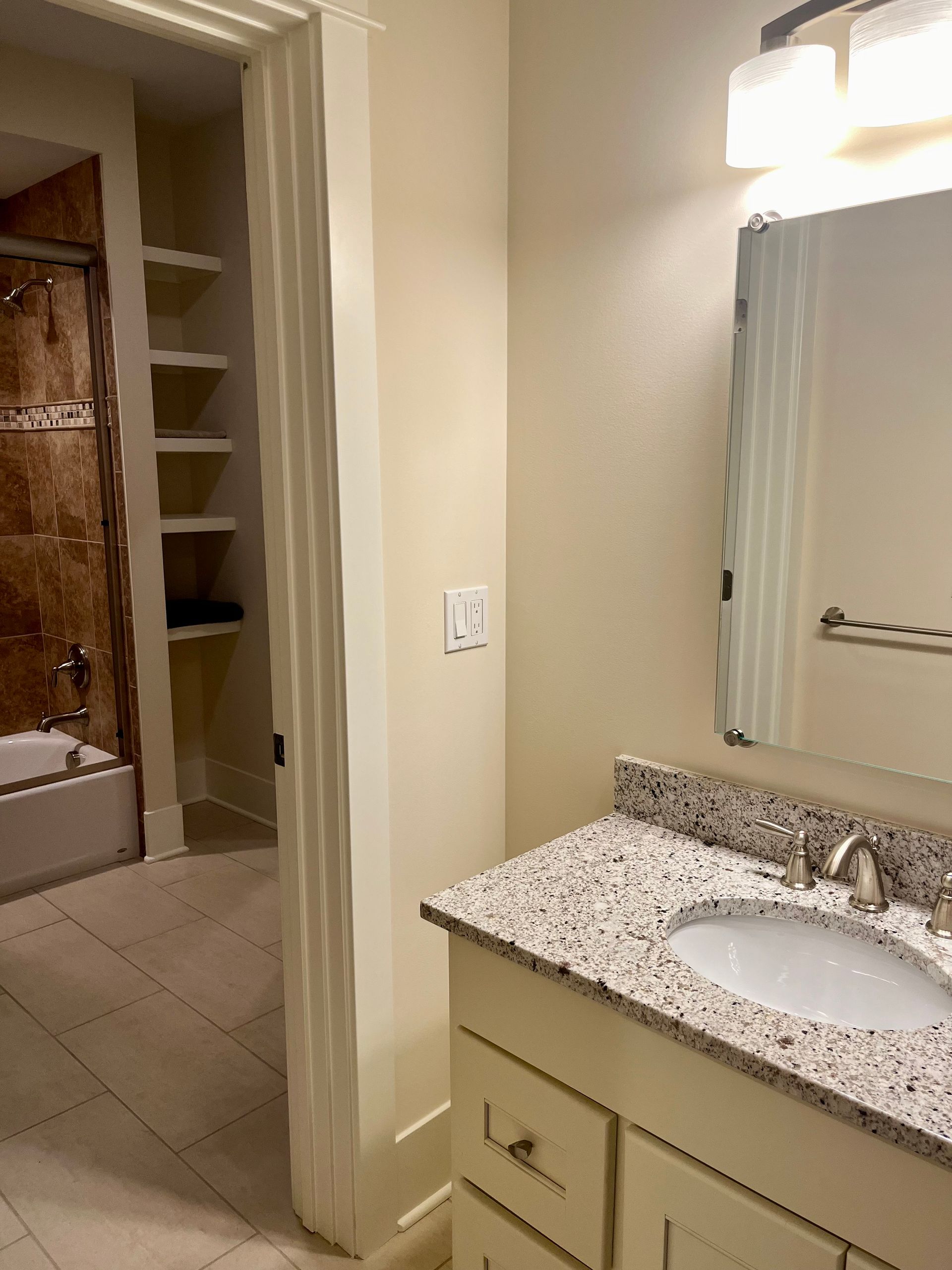 A bathroom with a sink and a mirror