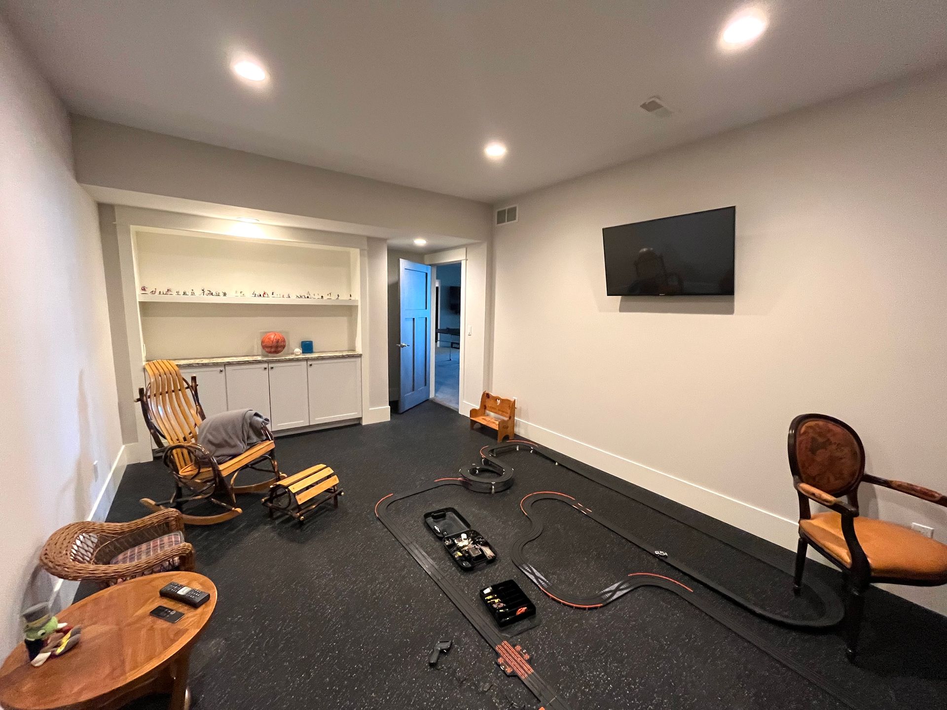 There is a race track in the middle of the room.