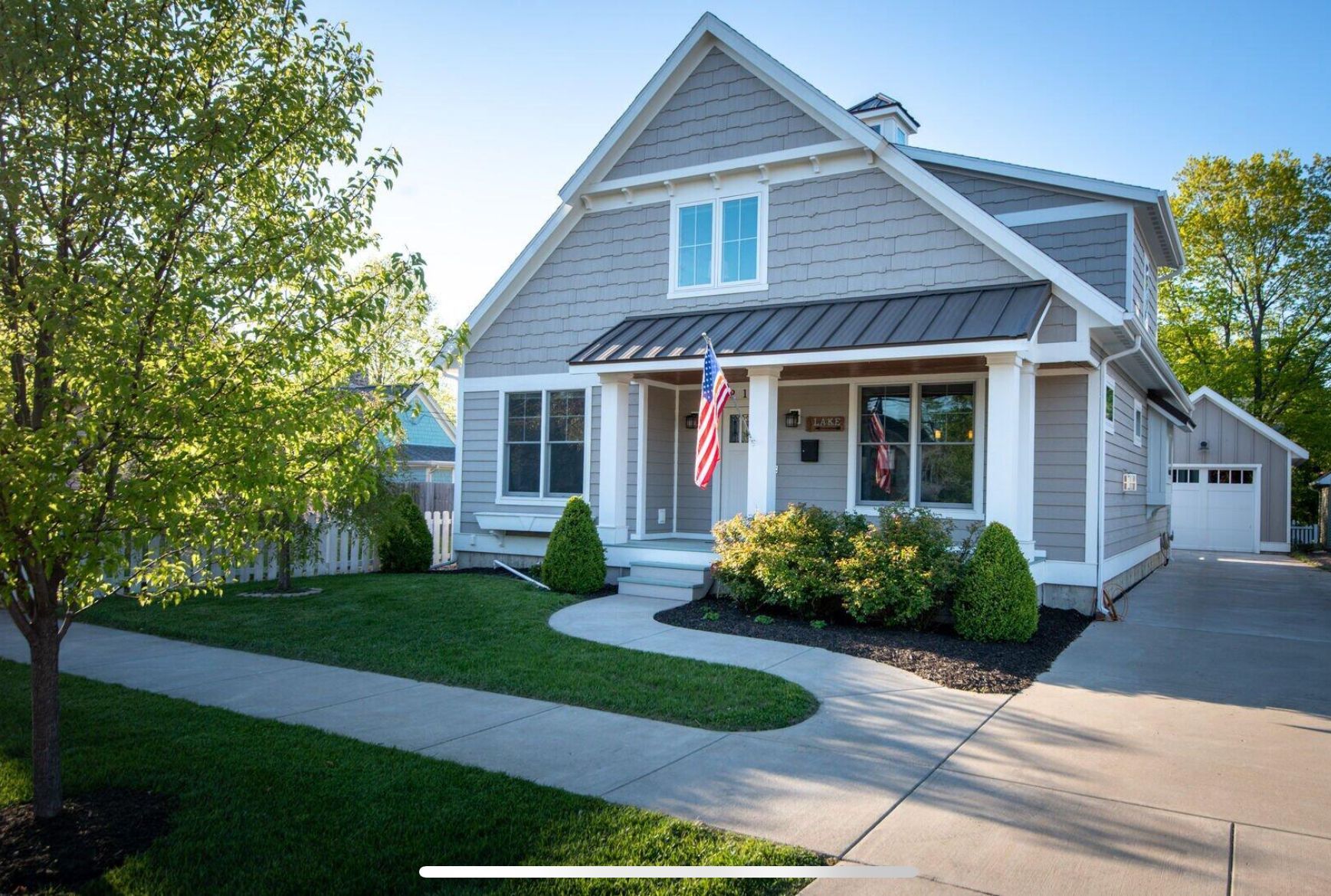 A house with a flag on the front porch