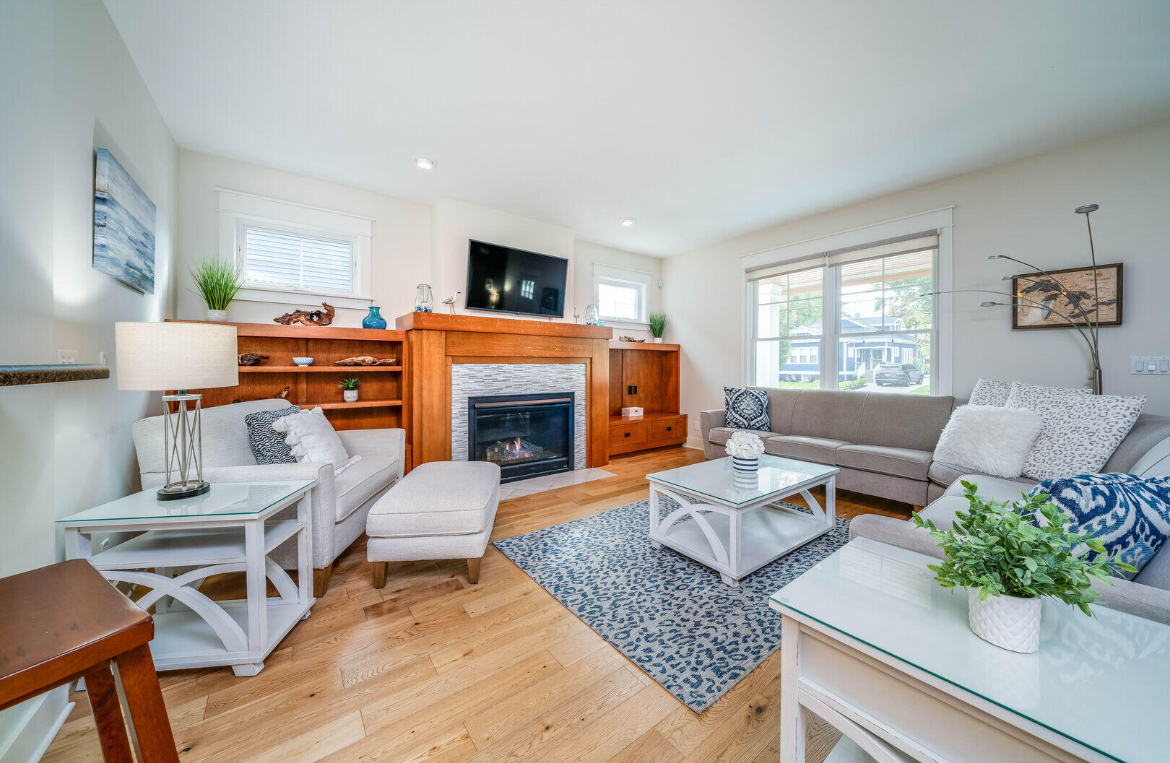 A living room filled with furniture and a fireplace.
